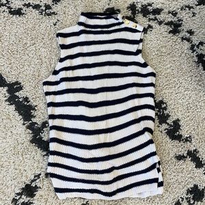 Navy and cream striped sleeveless sweater with gold button detail on shoulder